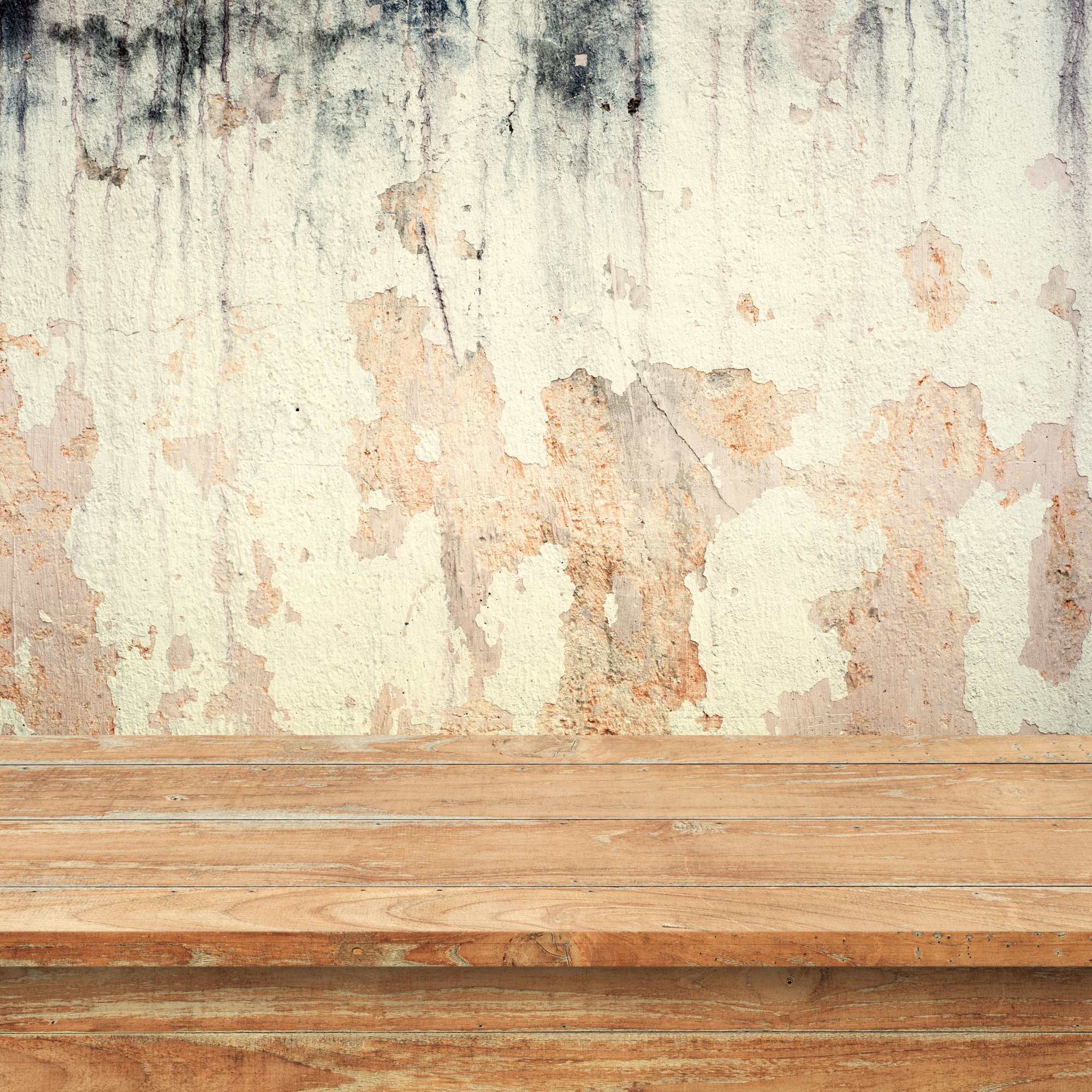 Wood Table against Worn Cement Wall